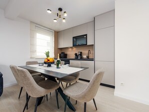 A modern kitchen with a dining area. - Seaview apartment Casa Almaris A2 by Interhome (Zadar/Kožino)