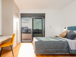 A modern bedroom with a bed, a desk, and a chair. - Seaview Villa Mar with pool, jacuzzi and sauna by Interhome (Privlaka)