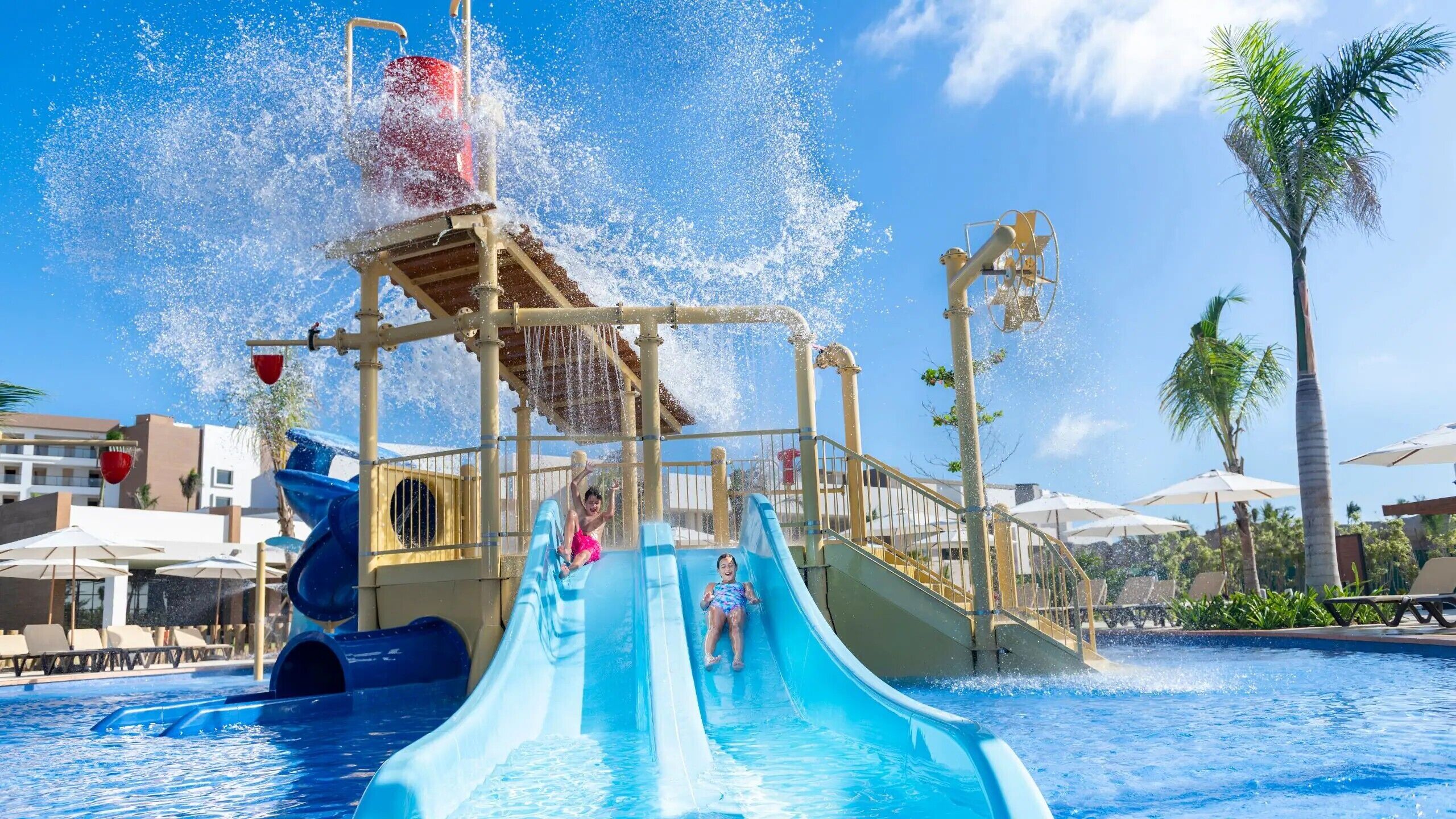 A water park with multiple slides and a pool area.