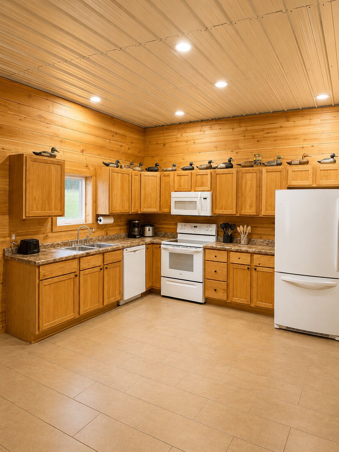 A kitchen with wooden cabinets, a microwave, a stove, and a refrigerator.