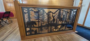 A framed wildlife scene with a wooden border. - Beautiful Modern Cabin in the woods (Daniels)