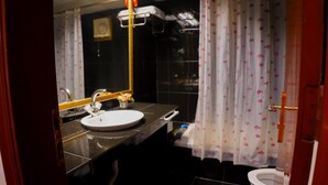 Executive Room | Bathroom | Hair dryer, slippers, towels, soap