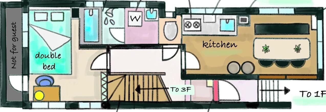 A hotel room layout with a double bed, a kitchen, and a bathroom.
