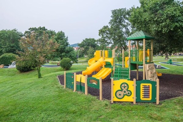 A playground with a slide and climbing structures. - 2BR Retreat | Near Lake & Attractions (Branson)