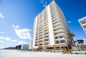 A tall, multi-story hotel with balconies, located near a beach. - Atalaya Towers - 3 Bedroom (Murrells Inlet)