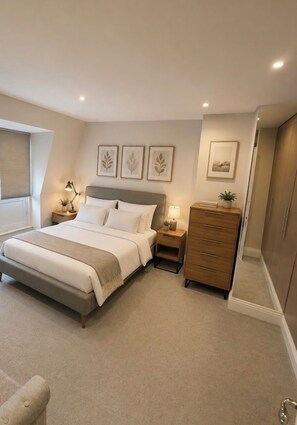 A bedroom with a bed, bedside tables, a dresser, and a window with blinds. - Mr Marylebone · Stylish 3BR Home · Sleeps 6 (London)