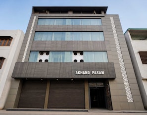 A building with a modern facade, featuring a prominent sign that reads 'AKHAND PARAM'. - Classic Akhand Param (Begusarai)