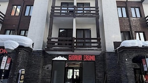 A multi-story building with a prominent entrance labeled 'GODDART CASINO.'