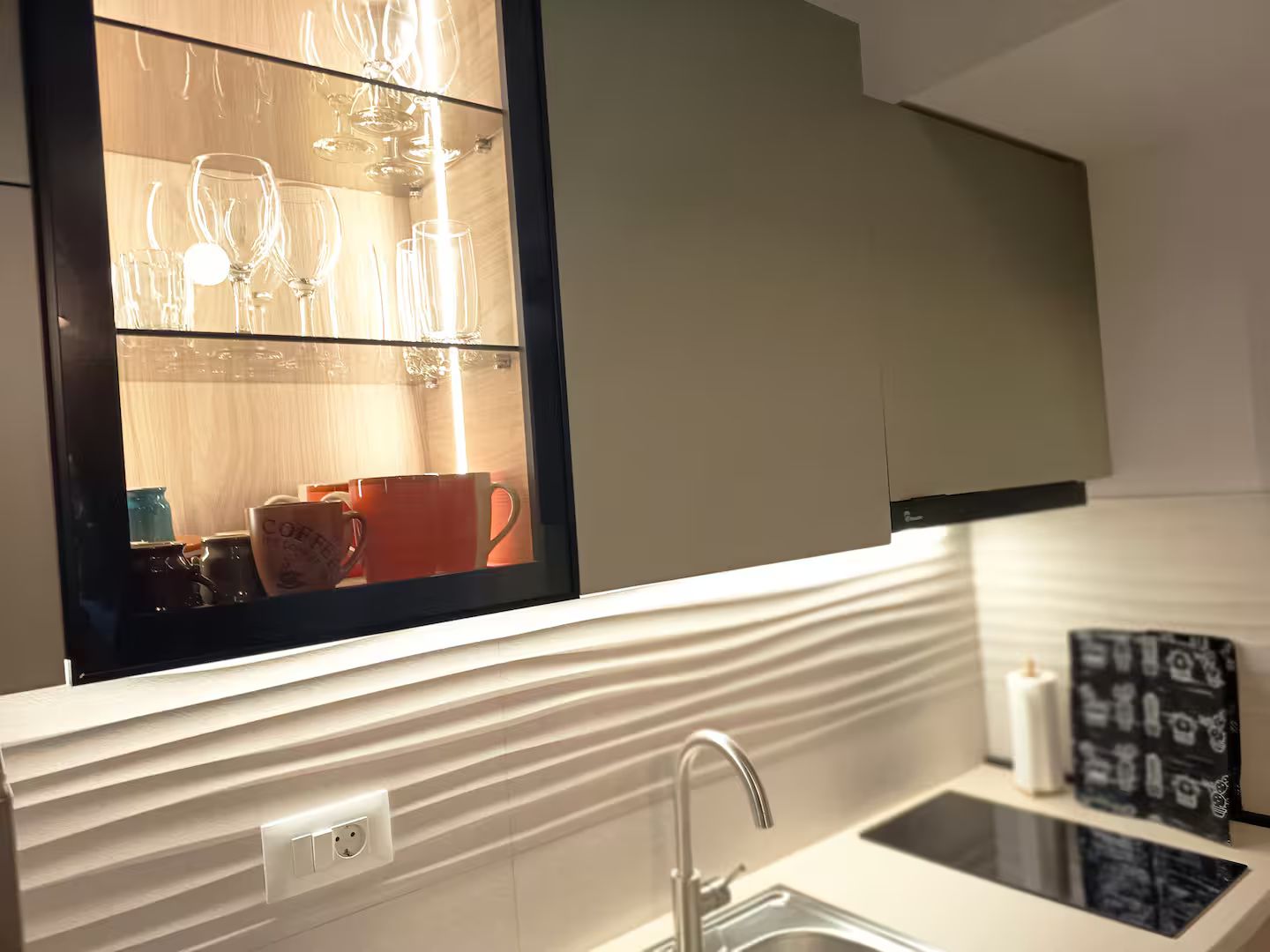 A kitchen with a window, a sink, and a countertop.
