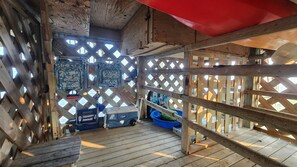 A wooden deck with a lattice structure, a blue cooler, and a blue container. - Pet-Friendly Soundfront Retreat with Private Dock & Incredible Sunsets. (Avon)
