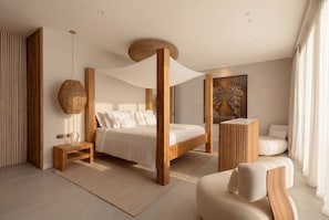 A modern bedroom with a four-poster bed, a round hanging light, a side table, and a large painting. - Villa OASIS - Jeri (Jijoca de Jericoacoara)