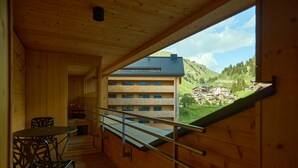 A wooden interior with a balcony overlooking a mountainous landscape. - 8036 Alpine Residence 36 (Schröcken)