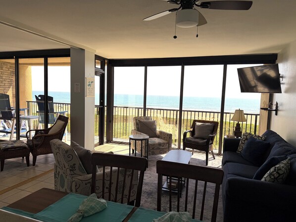 A room with a view of the ocean, furnished with a sofa, chairs, and a table. - Beachfront 2 Bedroom Condo W/Amazing Gulf Views, Free WiFi, Gated Free Parking (South Padre Island)