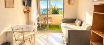 Quiet studio apartment with a view of the pond, air conditioning, and parking
