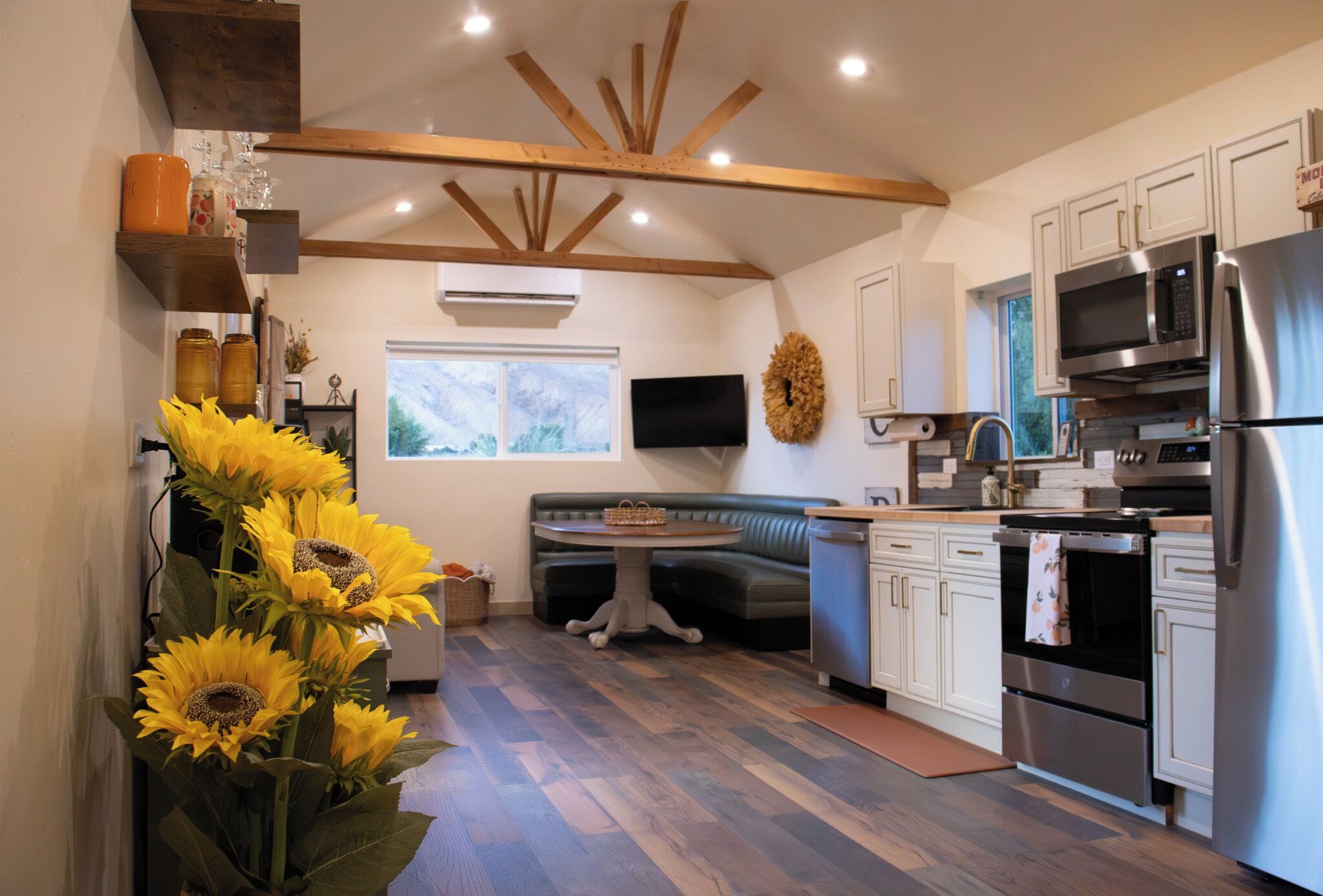 A modern kitchen with a built-in oven, microwave, and refrigerator.