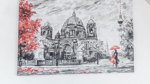 A monochrome architectural drawing of a building with domes and a statue, a tree with red leaves, and a person with an umbrella.