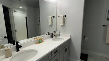 Shower, hair dryer, towels, soap