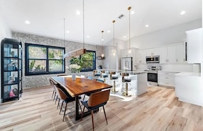 Beautiful open kitchen with large island and stainless appliances