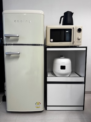 A kitchenette with a white refrigerator, a microwave, and a coffee maker. - 군자역3분 /성수/건대/KSPO/광화문/공항버스역3분/퀸침대3개/최대6인 (Seoul)