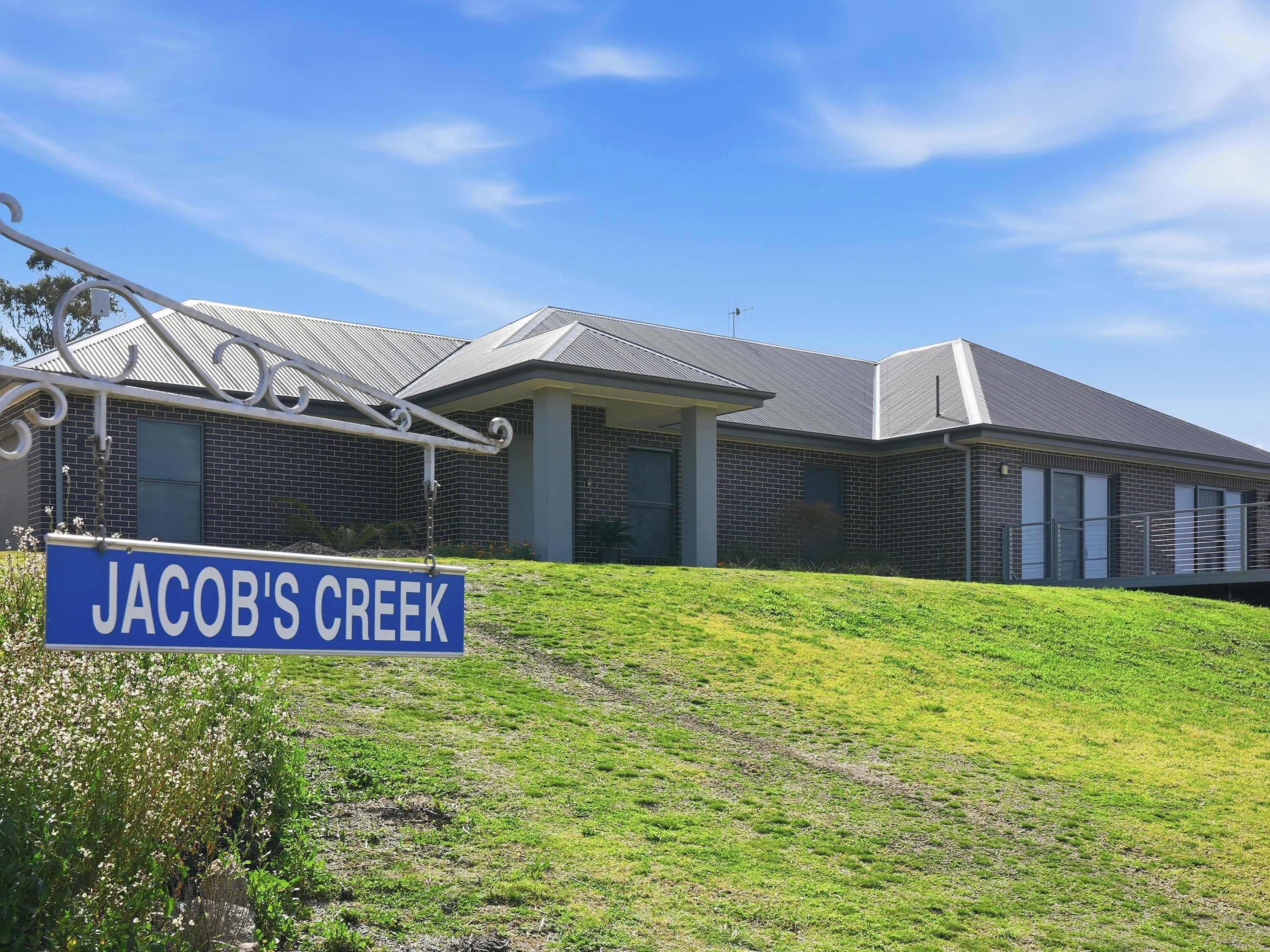 A modern building with a sign reading 'Jacob's Creek.'