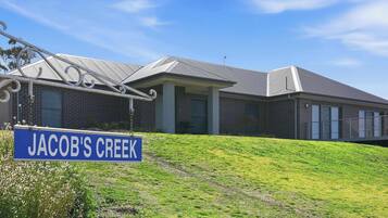 A modern building with a sign reading 'Jacob's Creek.'
