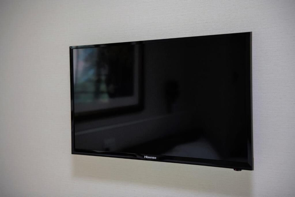 A flat-screen TV mounted on a wall.