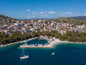 A coastal town with a marina, buildings, and a clear blue sky. - Luxury villa Fleur with pool by Interhome (Drage)