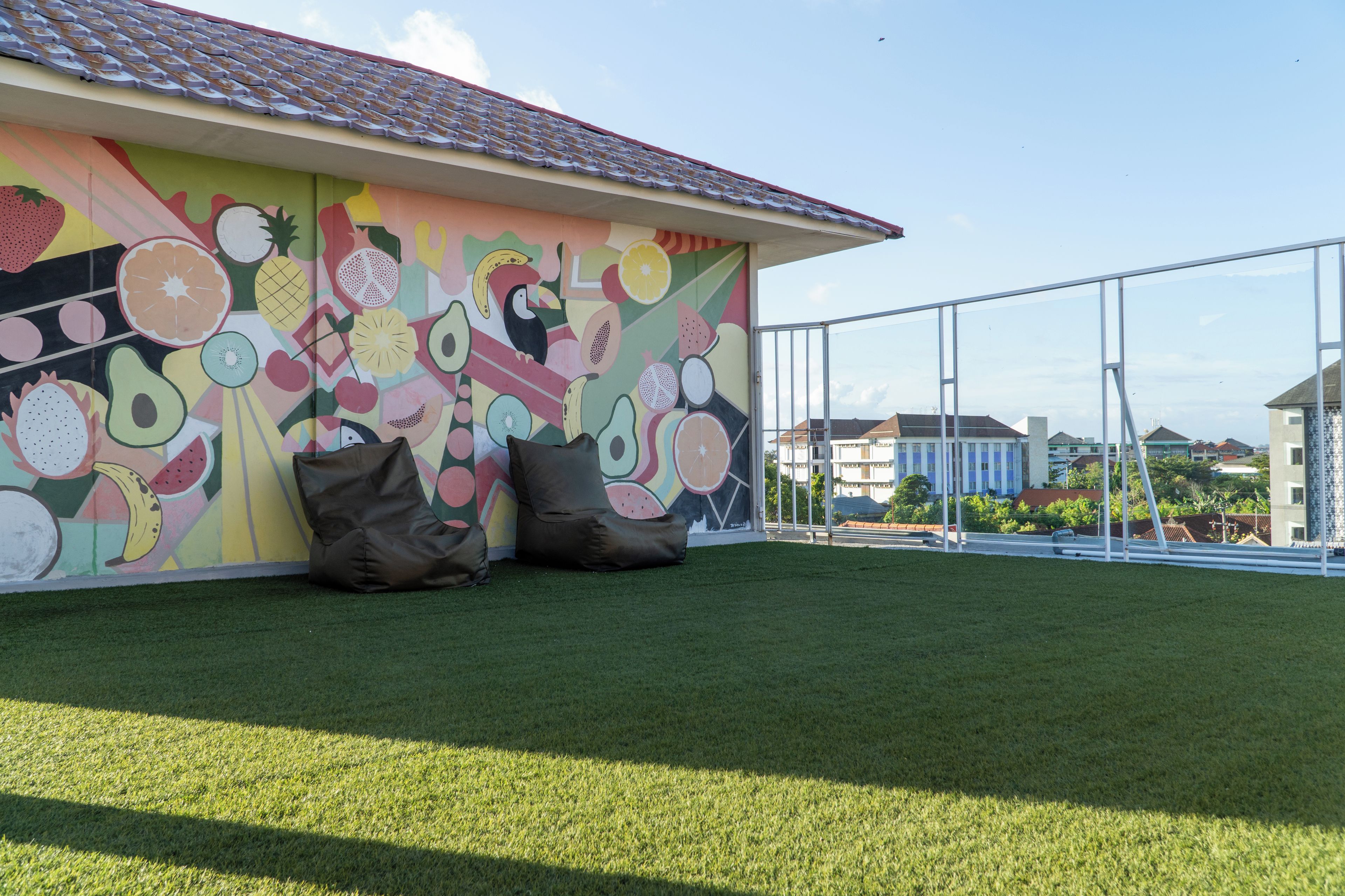 A building with a colorful fruit and vegetable mural.