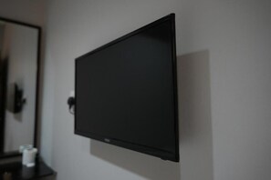 A flat-screen TV mounted on a wall.
