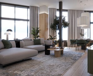 Una sala de estar moderna con un sofá modular, una mesa de centro y un comedor con sillas.