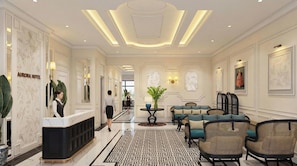 Een hotel lobby met een receptiebalie, een zithoek en decoratieve wandkunst.