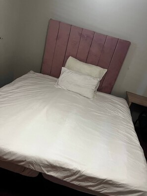 A bed with a headboard, a pillow, and a blanket. - Serene Guest Room Retreat Near Cape Town Airport (Cape Town)