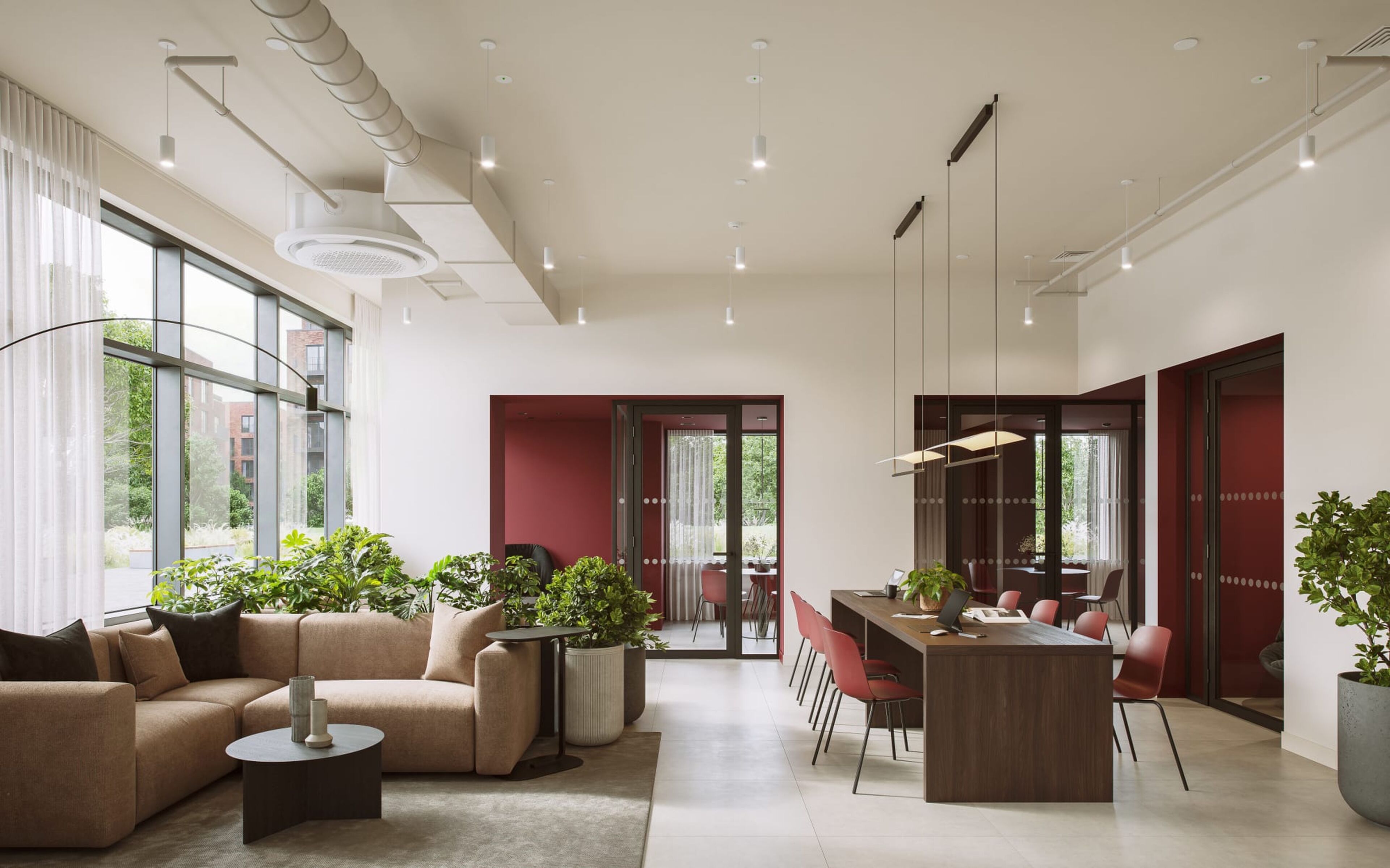 A modern interior with a sofa, coffee table, dining area, and potted plants.