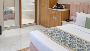 Quarto premium | Frigobar, Wi-Fi de cortesia, roupa de cama