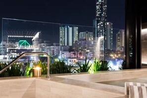 A rooftop terrace with a city skyline view, a water feature, and a staircase. - The Skyline Residence on the 23rd Floor (Fortitude Valley)