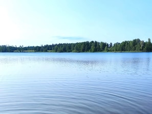 A calm lake with a forested shoreline. - 4 Star Holiday Home in Malmkoping (Malmkoping)