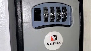 A keypad with a logo and the word 'VETRA' on a wall.