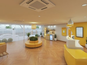 A reception area with a counter, seating, and potted plants. - Bloom Hotel - Salt Lake Sector V (Kolkata)