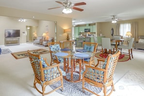 A spacious living room with a dining area, a kitchen, and a separate dining room. - Golf, Beach, Parks! Palm Coast Family Home w/ Yard (Palm Coast)