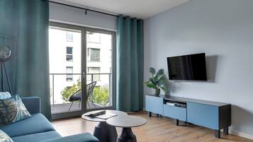 Superior Apartment, Balcony, Courtyard View | Living area | 40-inch flat-screen TV with cable channels