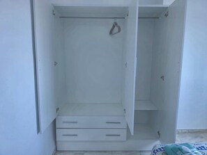 A white wardrobe with two drawers and a hanging space. - Two-Bedroom Apartment with Terrace and Sea Views near the Centre (Torremolinos)