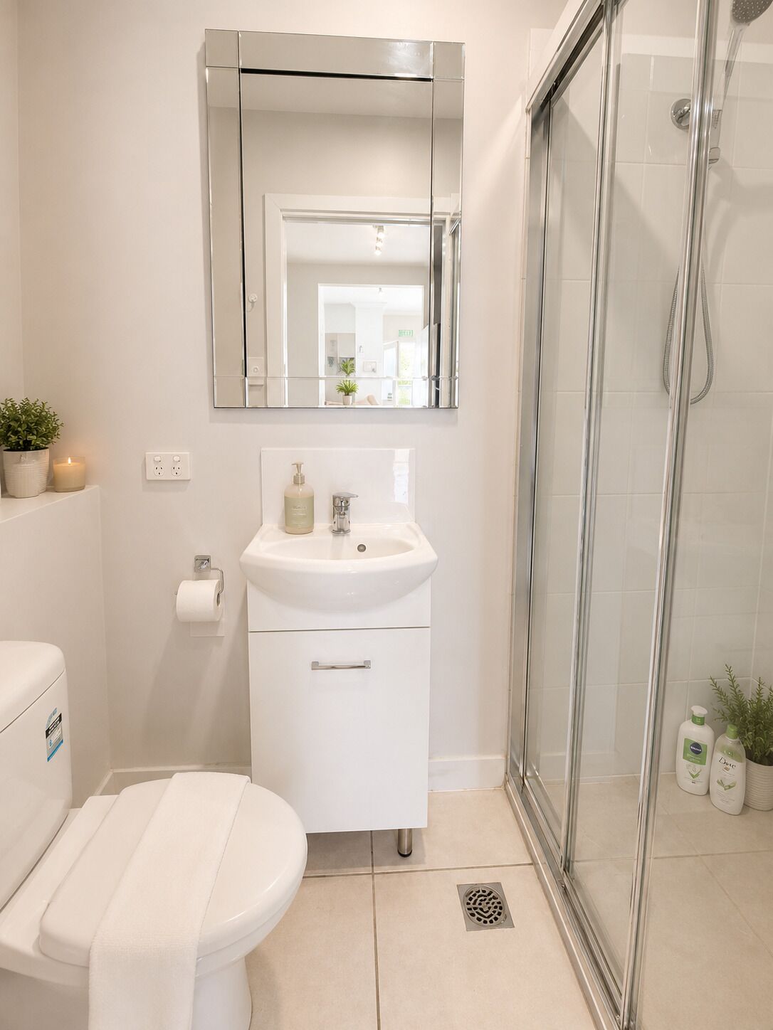 Shower, towels, soap, toilet paper