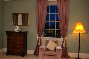 A room with a window, a chair, a lamp, a dresser, and a mirror. - South Hill House, Historic Georgian manor with capacity for 52 guests (Delvin)