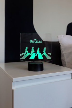 A framed Beatles album cover on a bedside table. - Flatzy - Iconic Beatles and Liverpool Culture Home (Liverpool)
