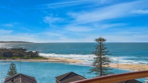 A coastal view with a beach, ocean, and a clear sky. - Eagle Wings - Stunning Ocean Views - Unit 16 (The Entrance)