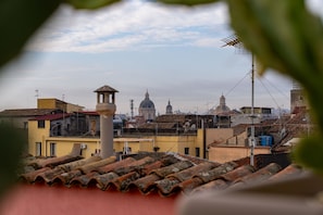 A cityscape with traditional architecture, including domed buildings and terracotta roofs. - Second-floor apartment, ideal for large families and groups of friends (Catania)