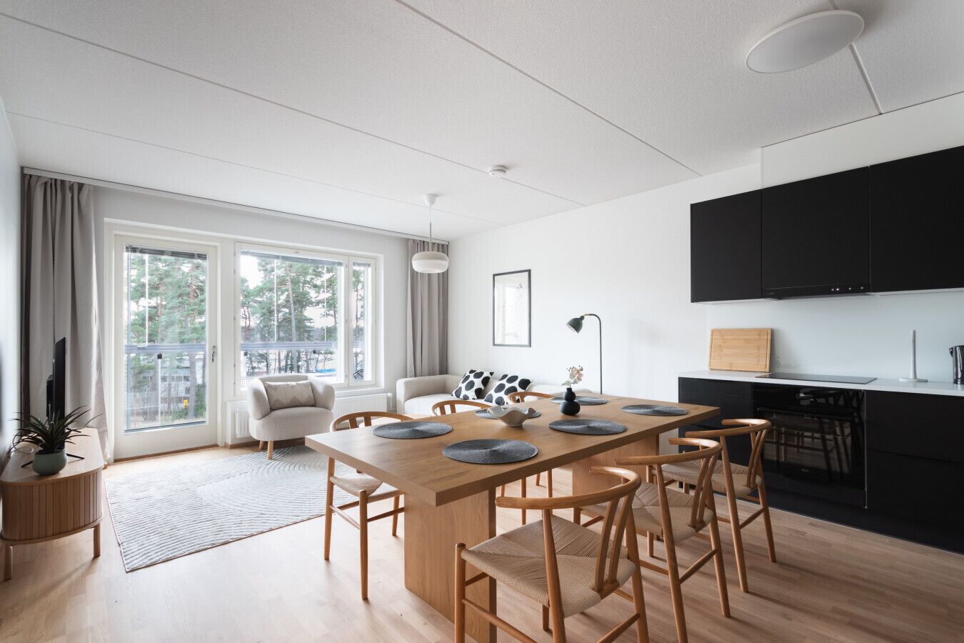 Spacious living area combined with fully equipped kitchen.