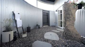 The Granary’s private Zen garden — a larger outdoor retreat with a seasonal hot-water shower, available May through October.