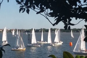 A marina with multiple sailboats docked. - Clear Lake Waterfront • Between NASA & Kemah (Seabrook)