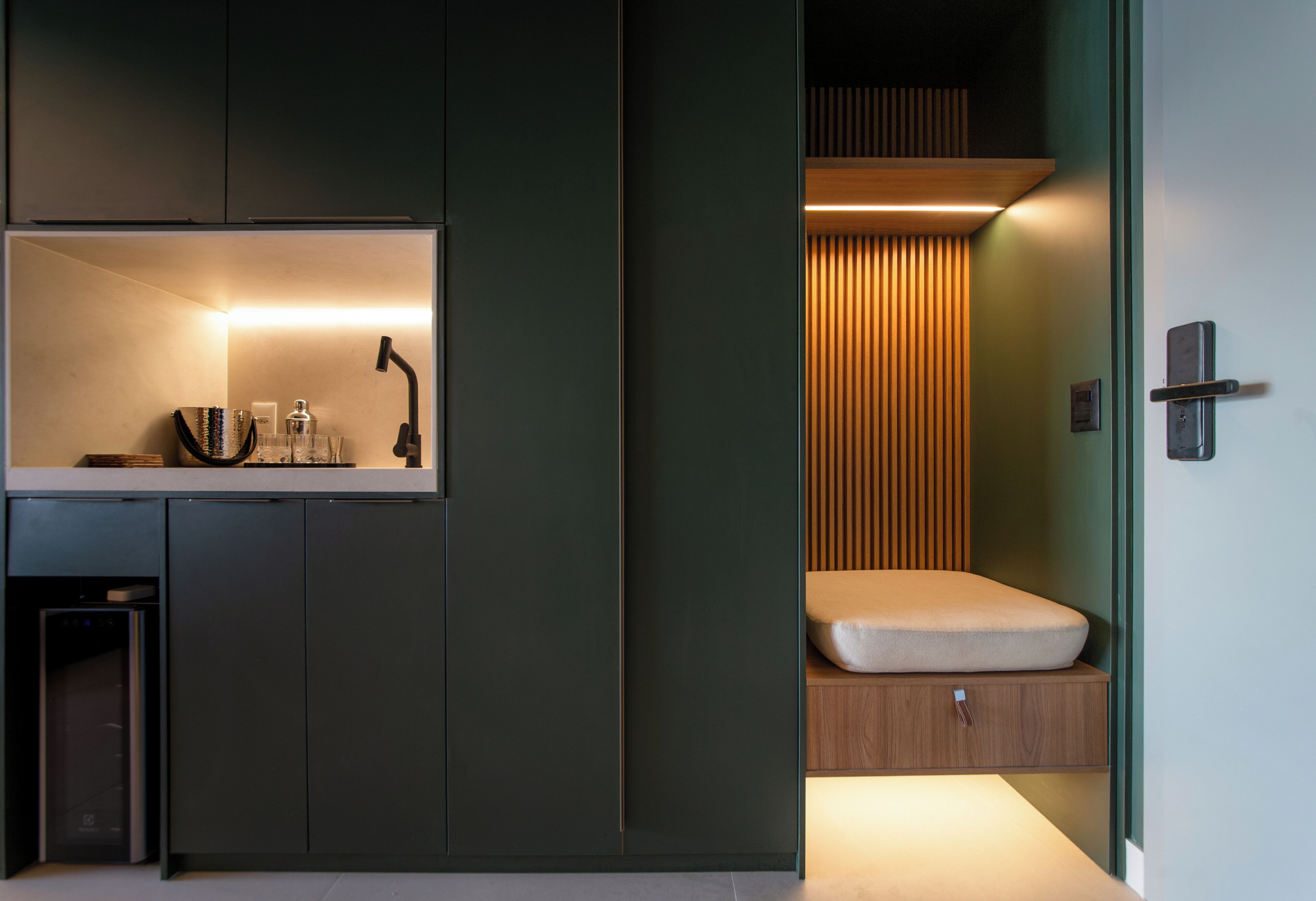A modern bathroom with a built-in shower, a vanity with a mirror, and a toilet.